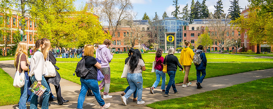 A group of students and parents during a campus tour on University of Oregon campus