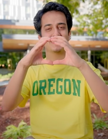 Meet Souhail holding up the O in front of Unthank Hall on UO Campus