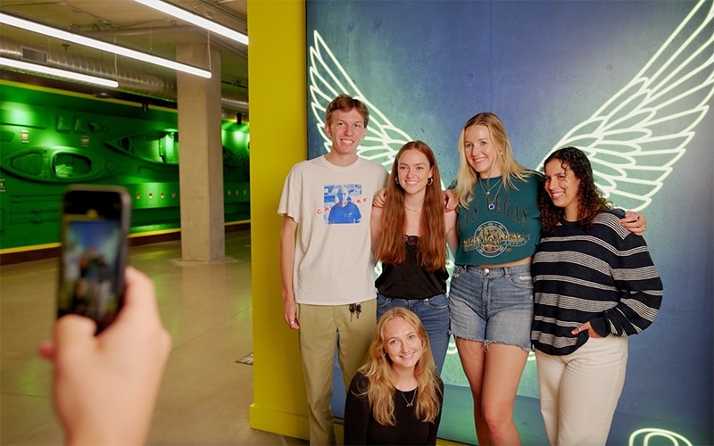 Photo of students taking a group picture at the Student Welcome Center